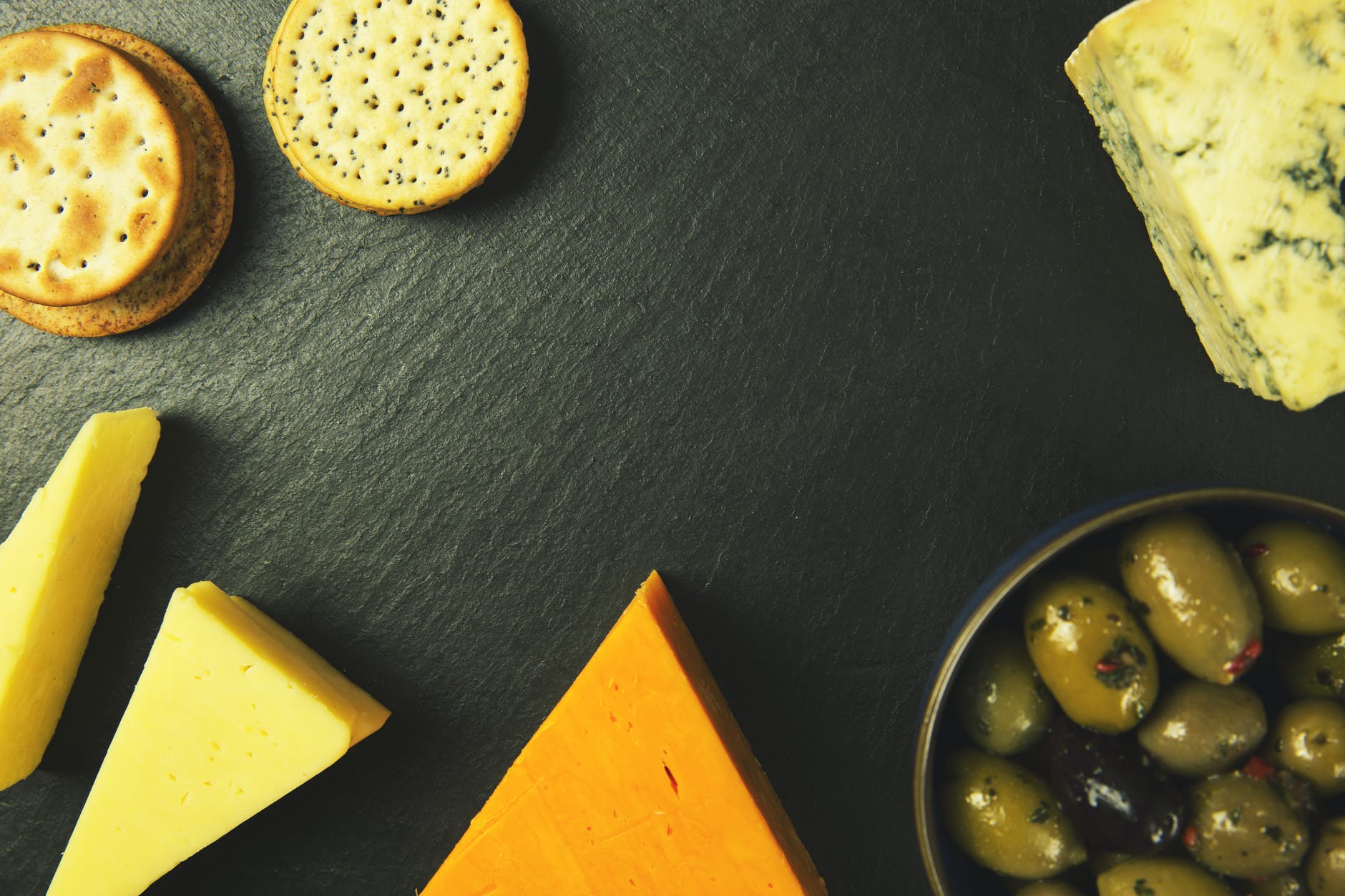 slice cheese biscuits and bowl of fruits